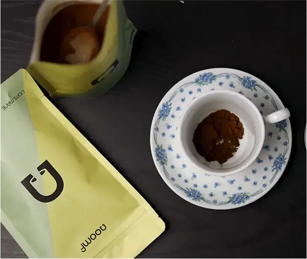 How to Make Noomf Mushroom Coffee - Add Spoonful of Mushroom Coffee into the Cup